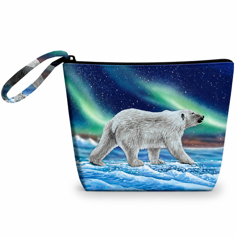 A zippered pouch with a wrist strap, featuring a printed design of a polar bear walking on icy water under a starry night sky with green aurora lights.