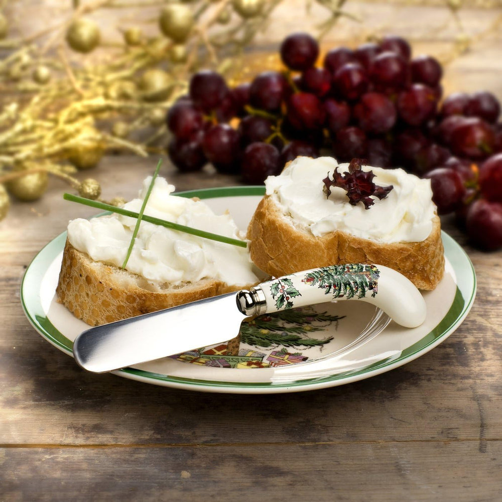 Christmas scene with spreader in Spode Christmas Tree pattern