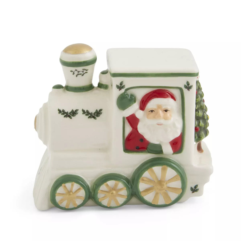 Festive ceramic train with Santa waving from a window, adorned with holly accents and green details. The cheerful holiday design evokes joy and warmth.