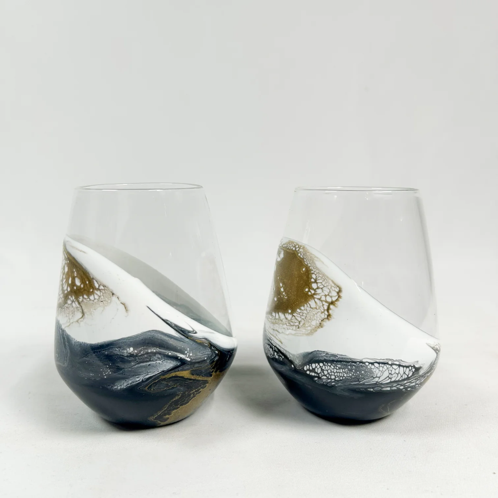 Stemless wine glass set in Onyx design by Lynn & Liana, featuring elegant black and white marbled detailing.