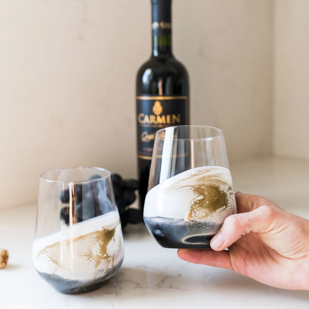 Stemless wine glass set in Onyx design by Lynn & Liana, featuring elegant black and white marbled detailing.