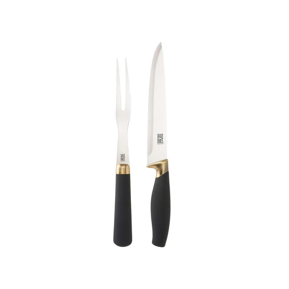 Two-piece carving set with a carving fork and a carving knife featuring black handles and brass-plated bolsters.