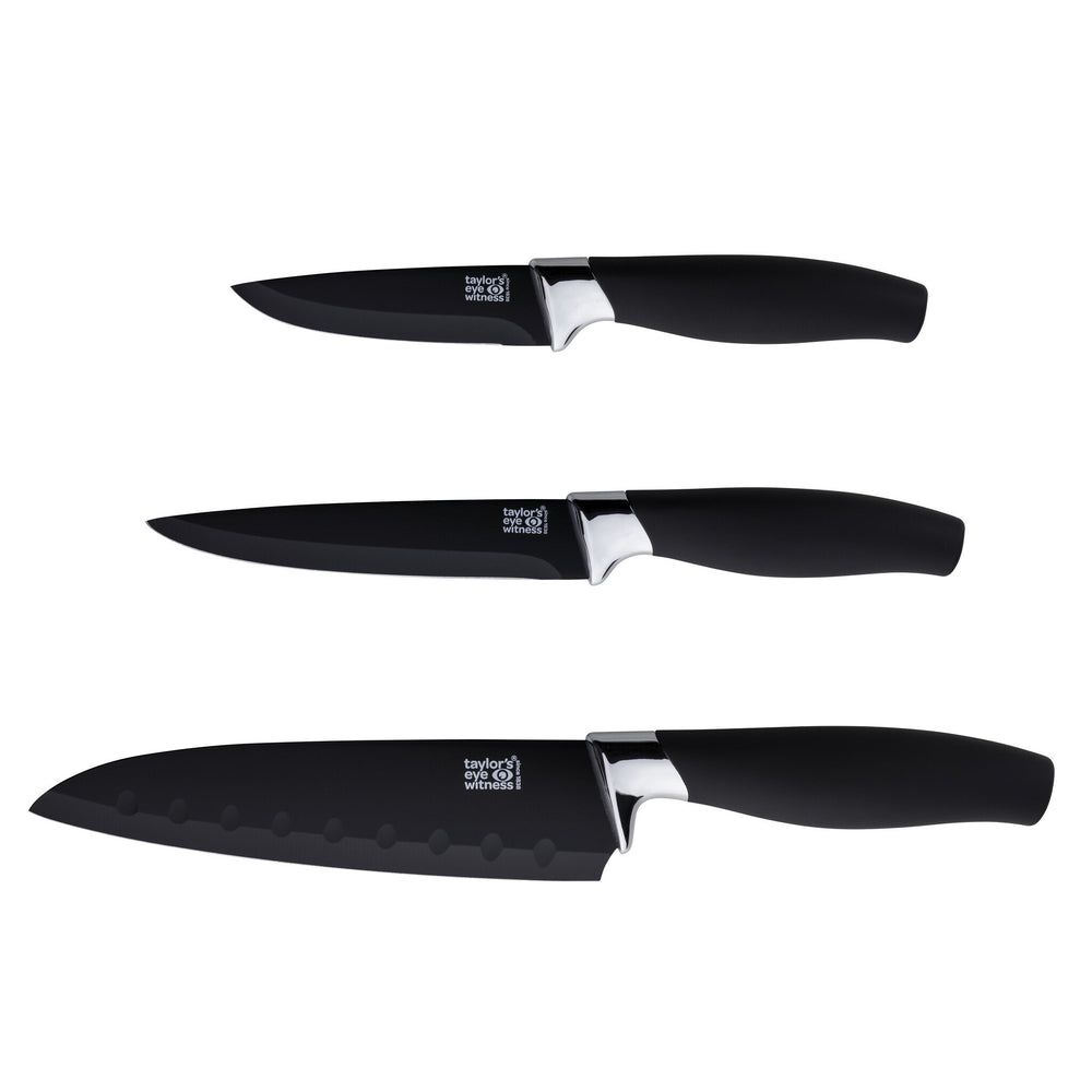 Three black kitchen knives with silver blades on a white background