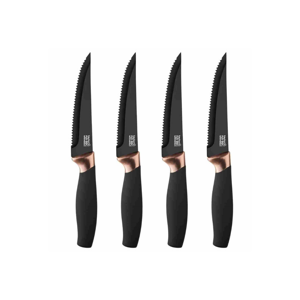 A set of four steak knives with black handles and copper bolsters.