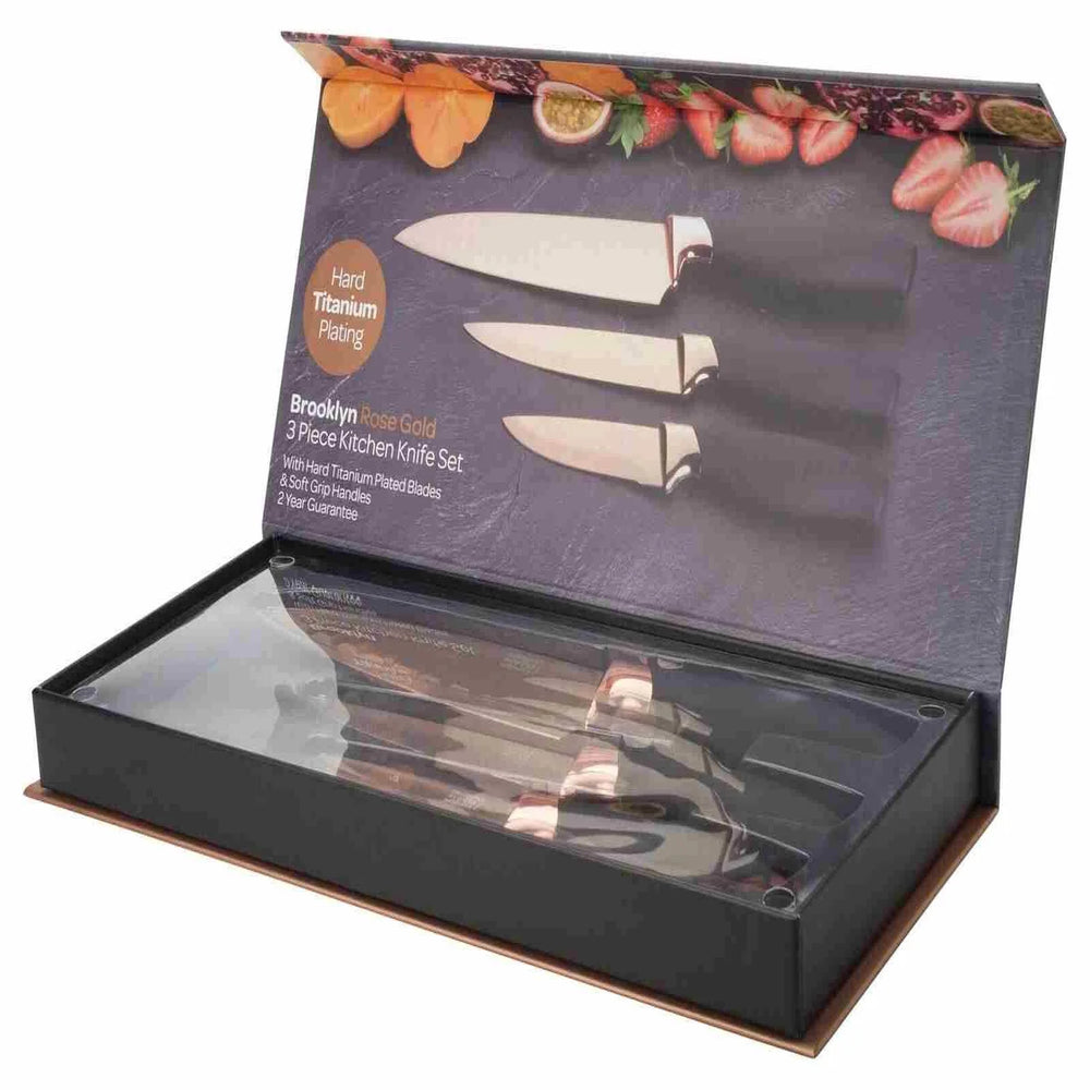 Three-piece kitchen knife set in a Brooklyn Knife Co packaging with fruit illustrations on a white background.