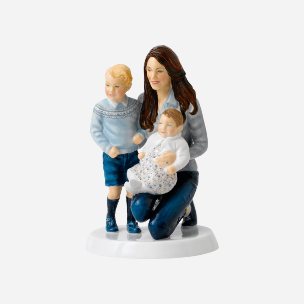 A Royal Doulton figurine depicting a woman with two young children, inspired by a photograph of HRH the Duchess of Cambridge with her children Prince George and Princess Charlotte.
