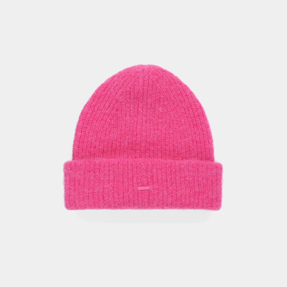 A bright pink ribbed knit beanie hat with a folded cuff, shown flat against a light gray background.