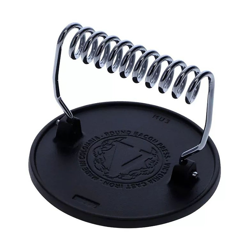 Black lid with metal spring on a white background