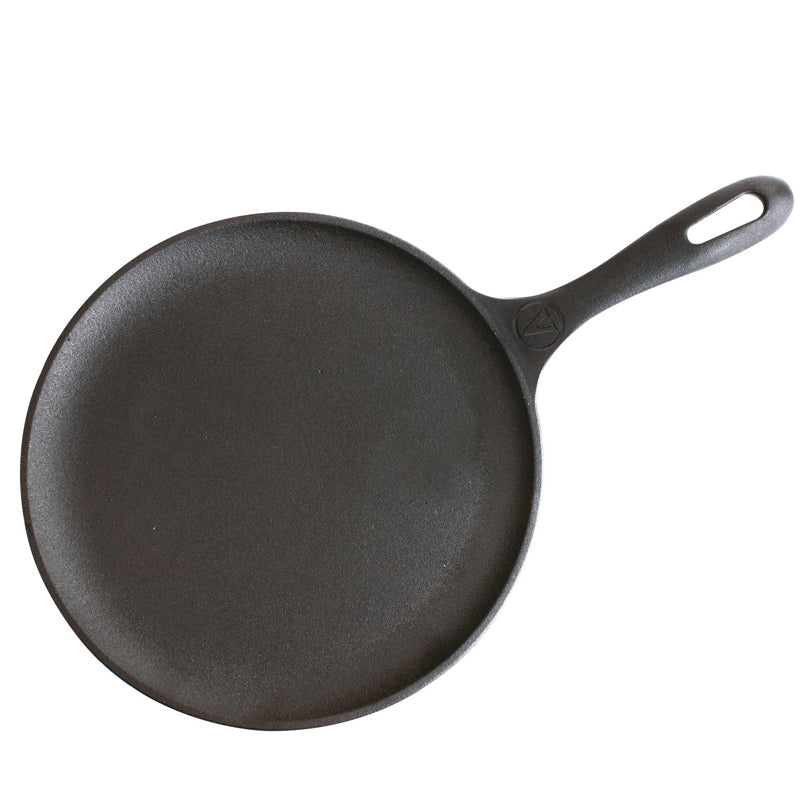 Black cast iron skillet on a white background