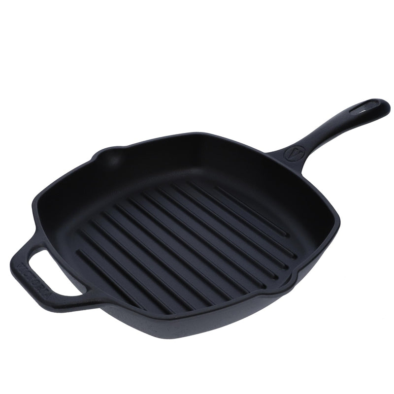 Black cast iron grill pan on a white background