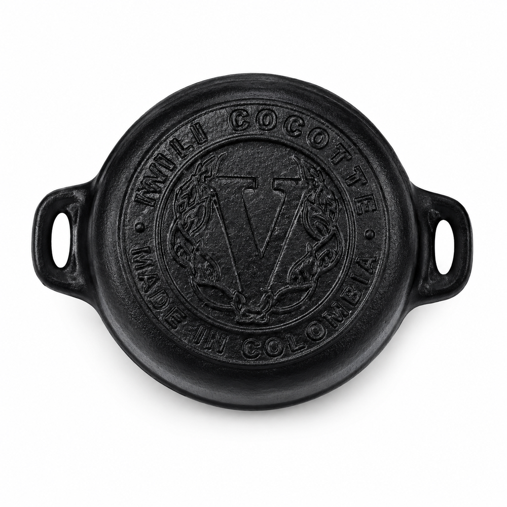 Black cast iron cocotte with 'V' logo on a white background