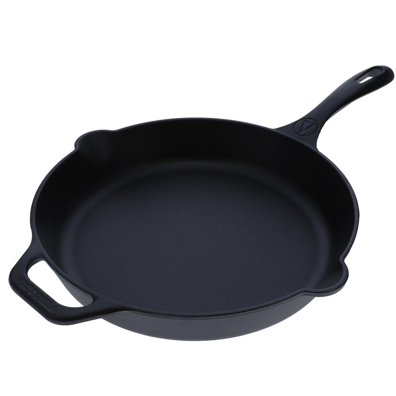 Black cast iron skillet on a white background