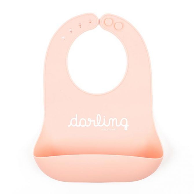 Pink bib with 'darling' text on a white background