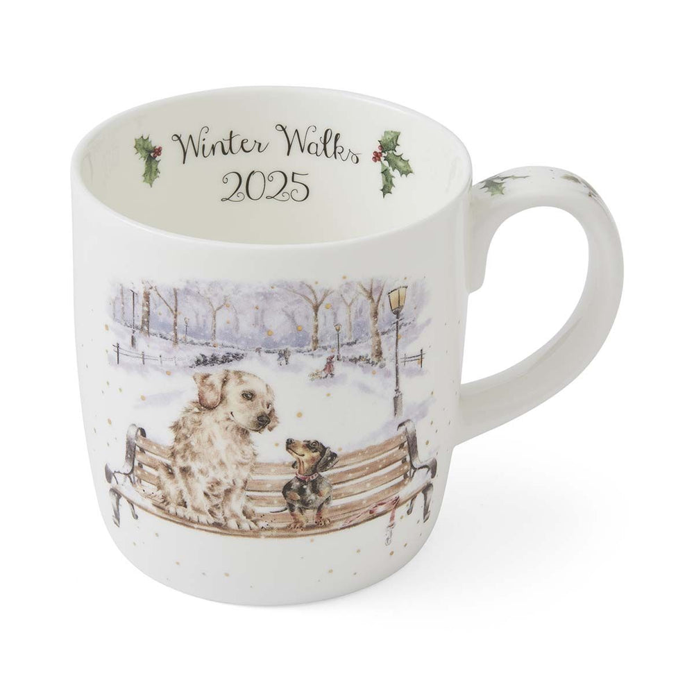 Mug with winter scene design and 'Winter Walks 2025' text on a white background