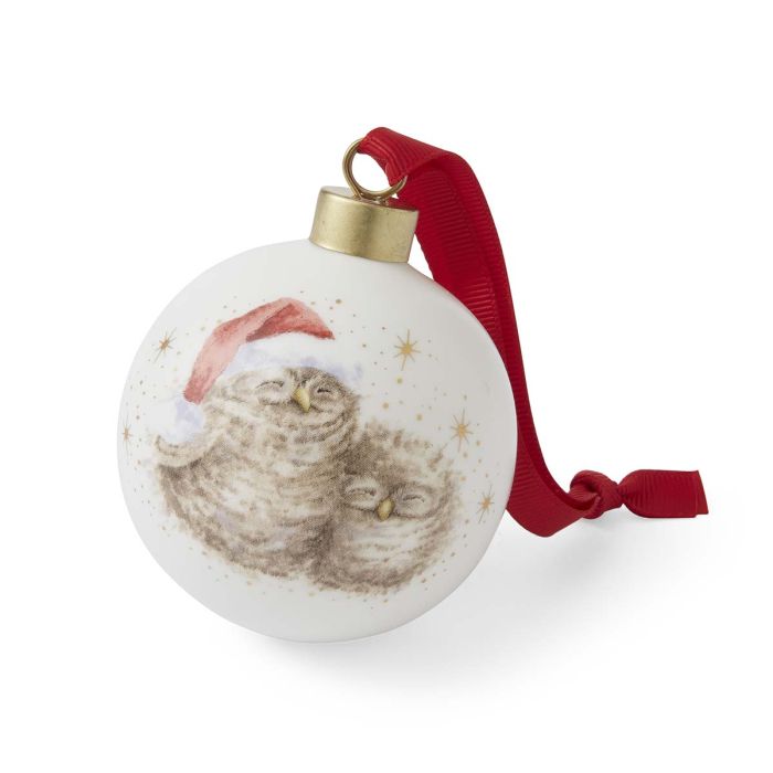 Christmas ornament with two owls wearing Santa hats and a red ribbon on a white background