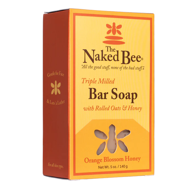 Packaged bar soap with 'The Naked Bee' brand and 'Orange Blossom Honey' scent, featuring an image of a bee and flowers.