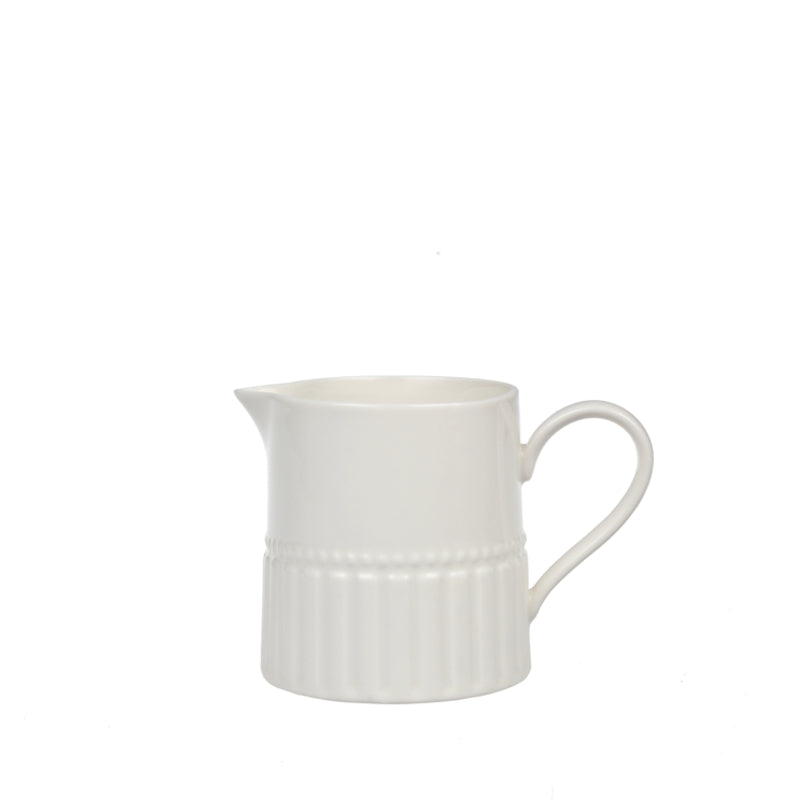 White ceramic pitcher on a white background