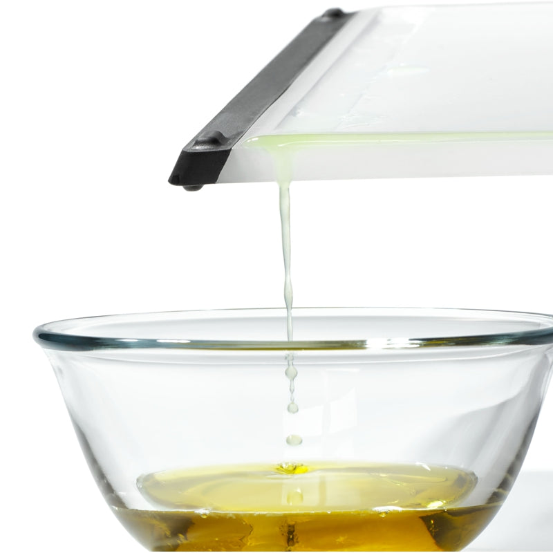 A large rectangular gray sink mat with a silicone surface and a rigid frame design for protection of sink, glasses, and dishes.