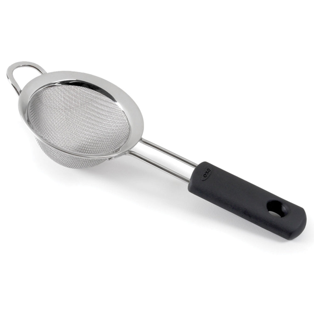 Metal strainer with a black handle on a white background