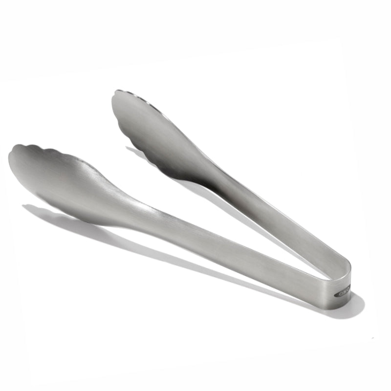 Metallic tongs on a white background