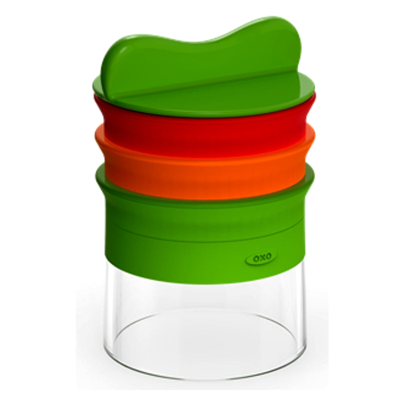 Stackable glass container with green, red, and orange lids on a white background