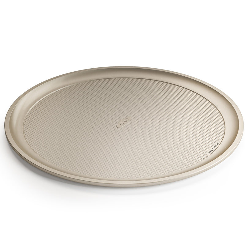 Beige round tray with textured surface on a white background