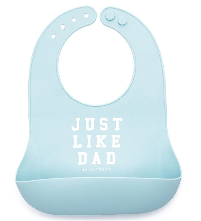 A baby blue silicone bib with the text 'JUST LIKE DAD' printed in the center.