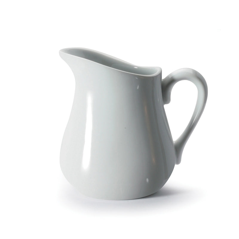 A white, porcelain creamer with a handle on the right side, displayed against a neutral background.
